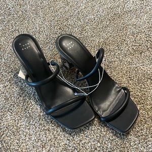 A new day black heels with snake print detail!